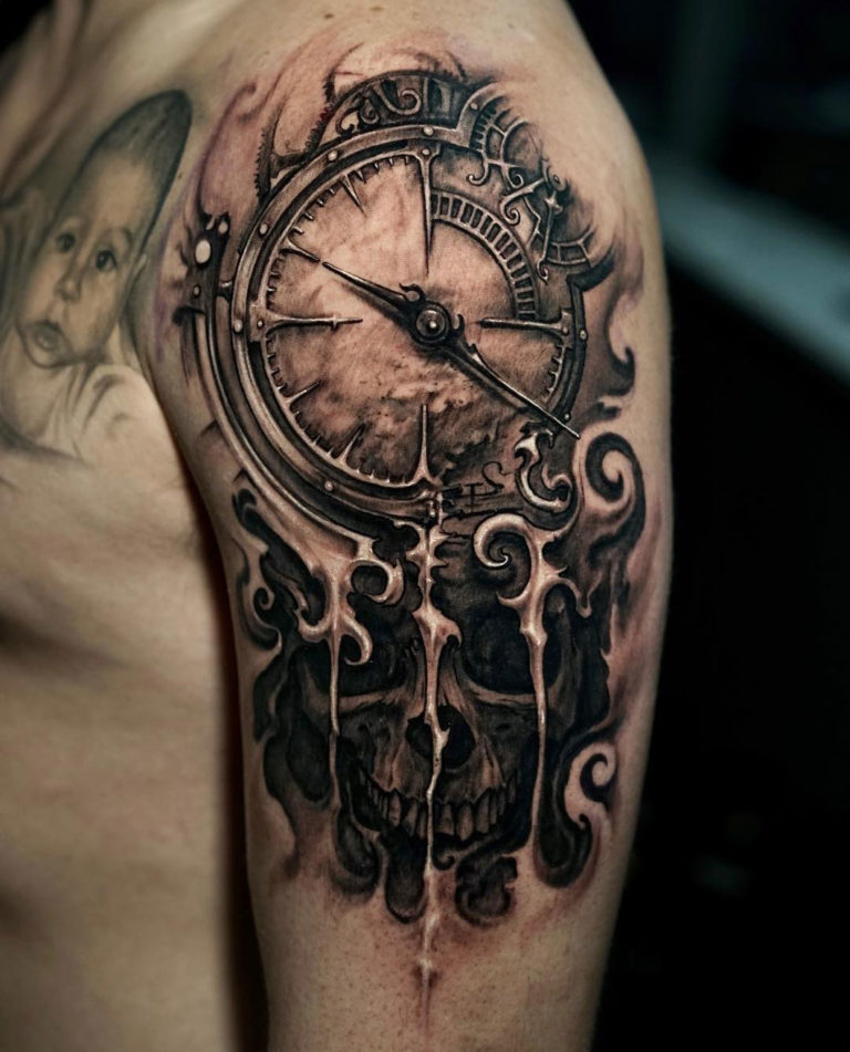 A Man With A Clock And Skull Tattoo On His Arm A Man With A Clock And Skull Tattoo On His Arm