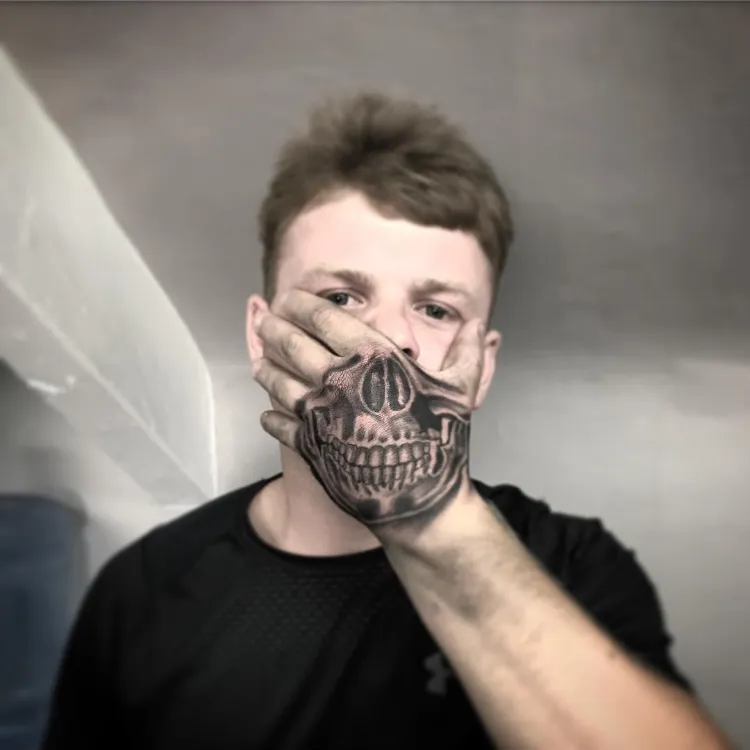 Joker Smiling Hand Tattoo Joker Smiling Hand Tattoo